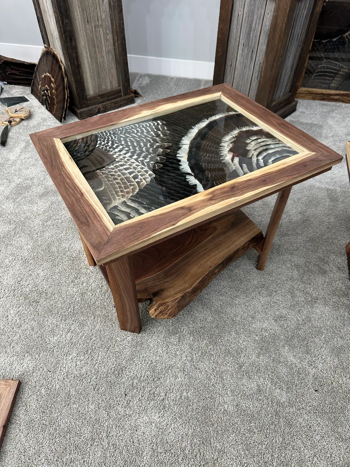 Turkey wing and fan feather art end table in walnut with live-edge shelf