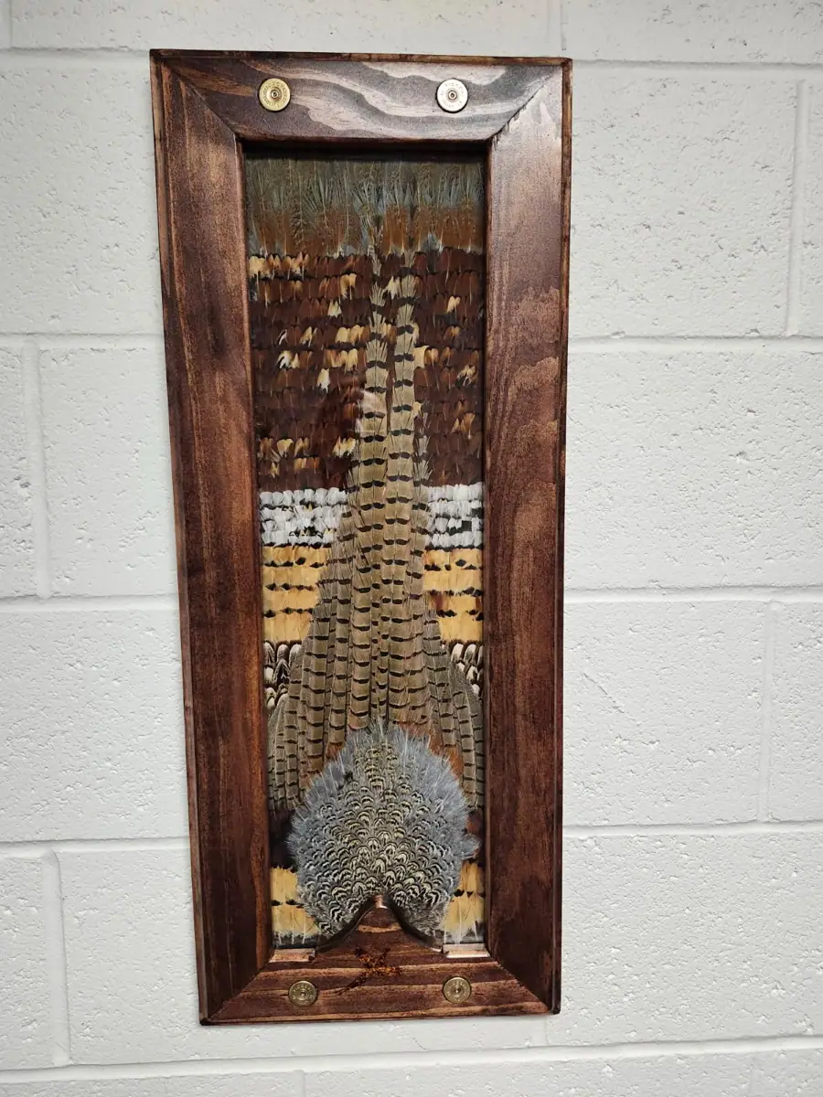 Student-built Pheasant piece in a tall walnut frame with corner medallions